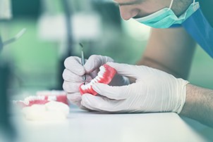 Dentist designing a set of dentures in Centerville