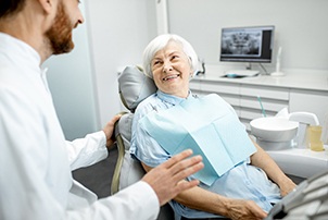 Dentist explaining the cost of dentures in Centerville to a patient