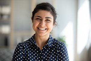 Dental employee smiling in a dental office