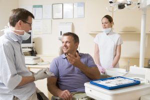 dentist and patient discussing dental insurance 