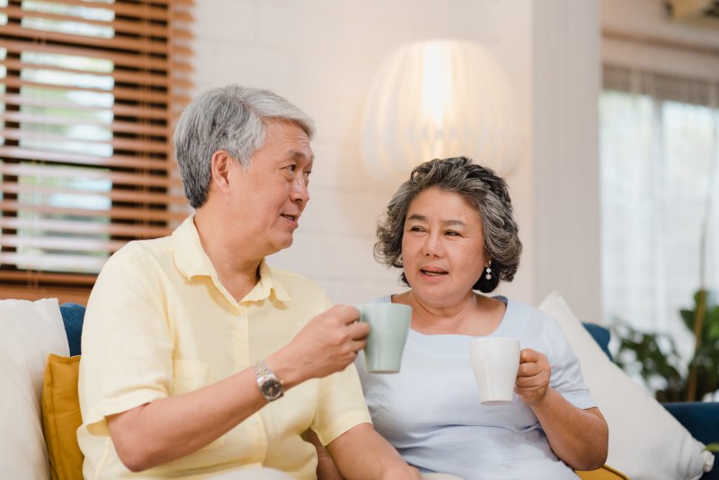 two people talking with dentures