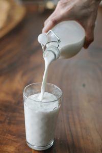 Milk being poured in glass