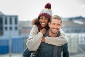 a couple smiling during the winter season